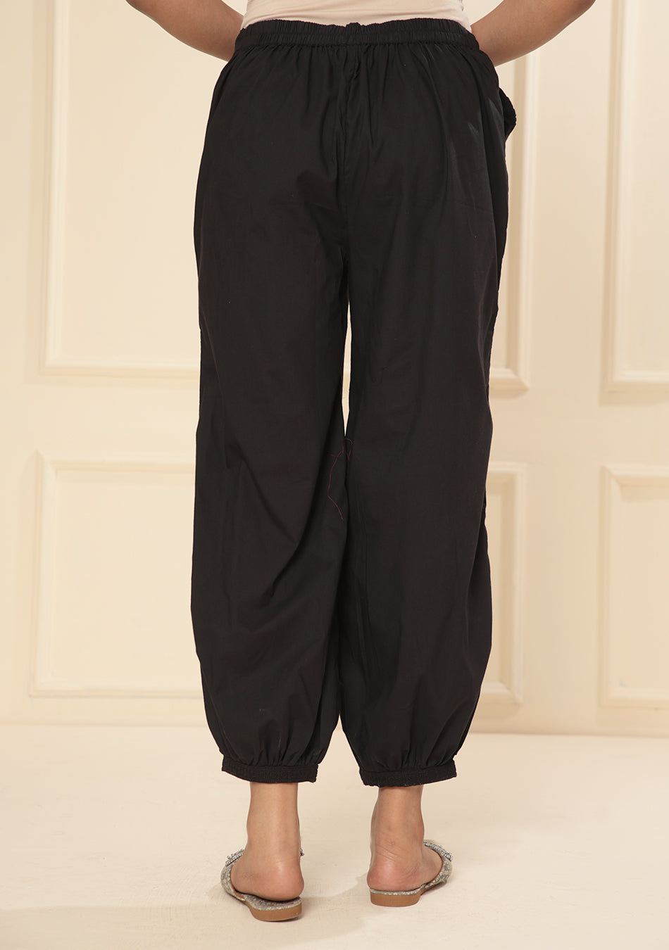 Black embroidered lace cuff pants