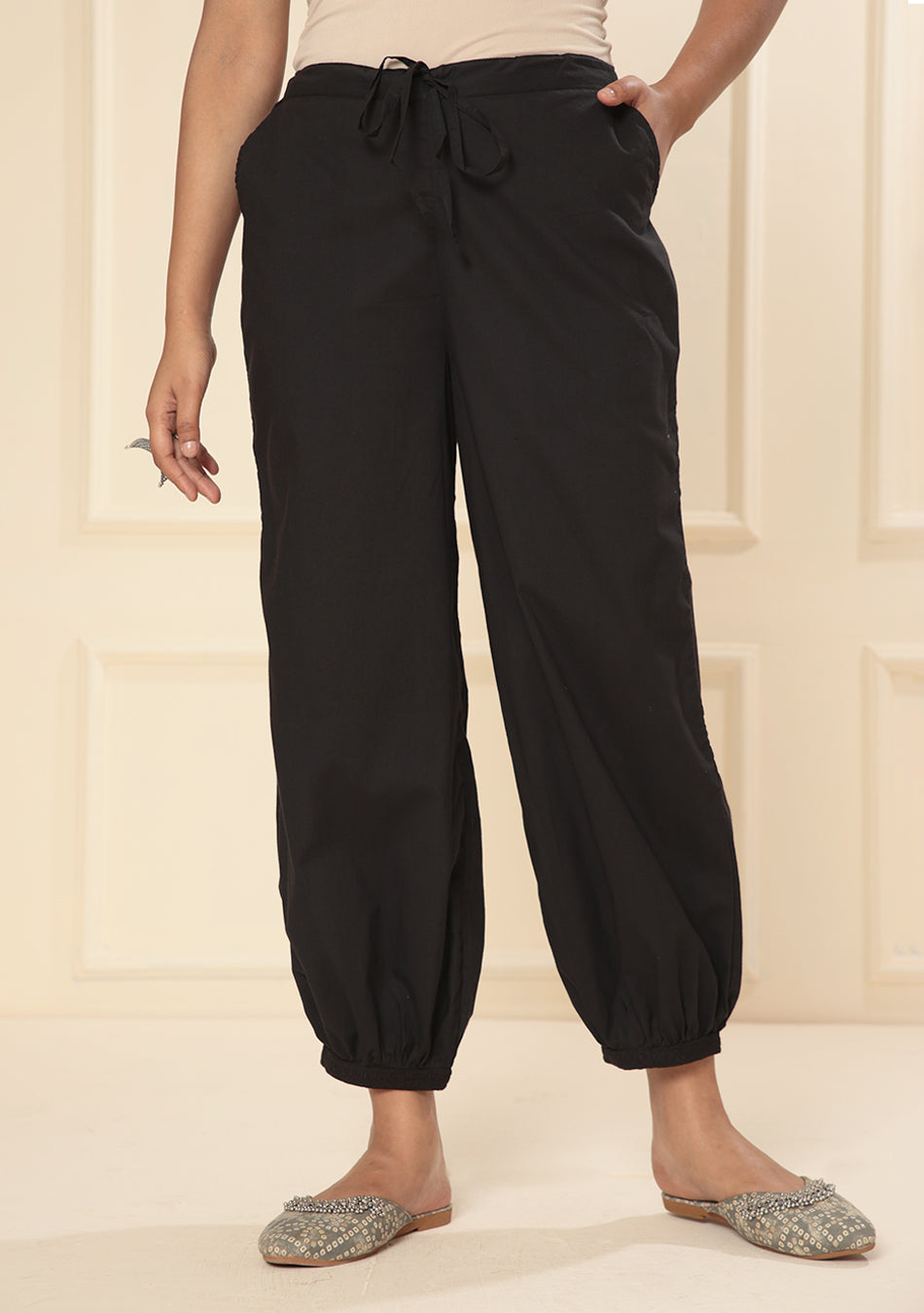 Black embroidered lace cuff pants