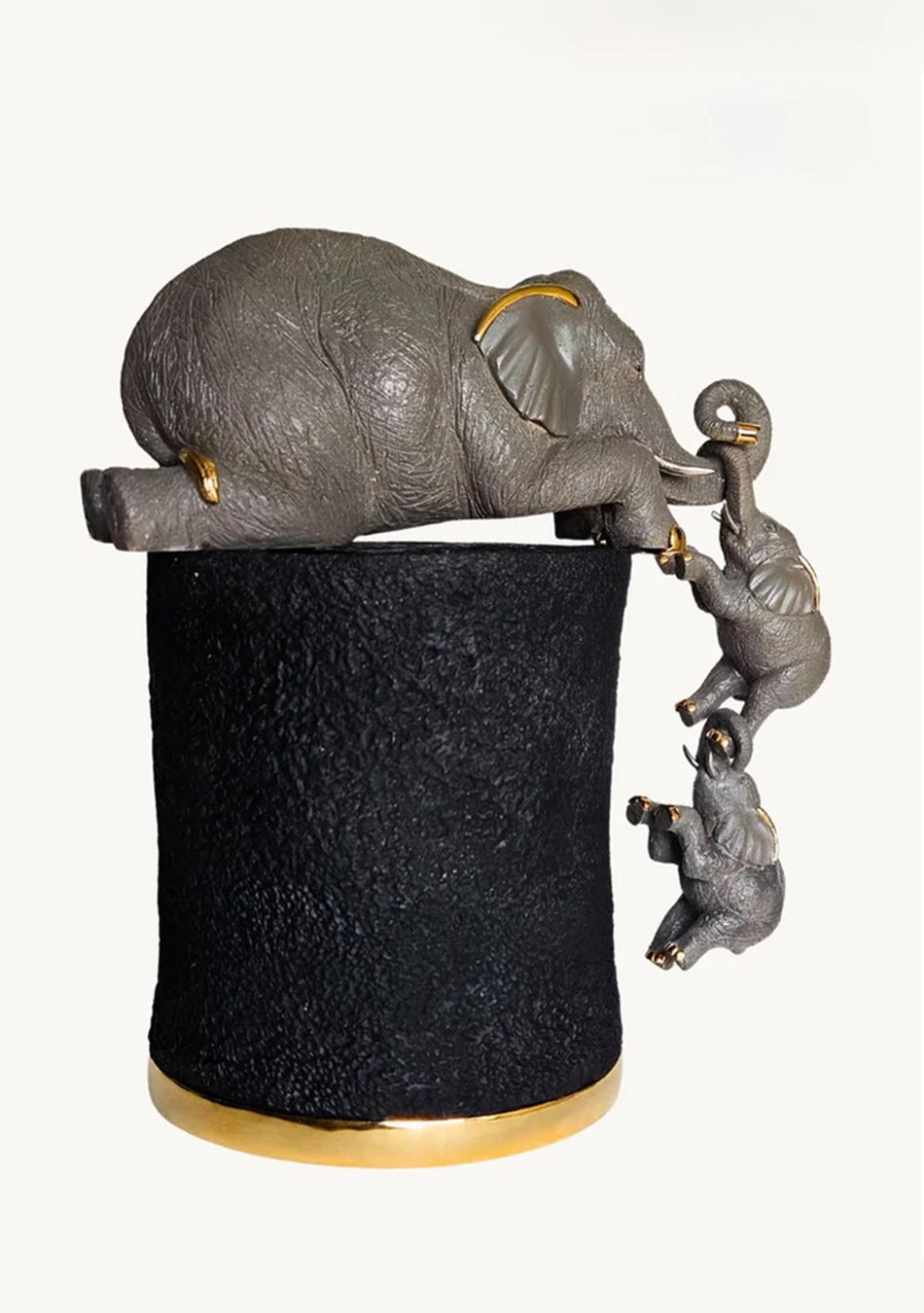 Aravalii Mother's Reach resin figurine featuring a mother and child sculpture with elegant electroplated metal details on a living room shelf