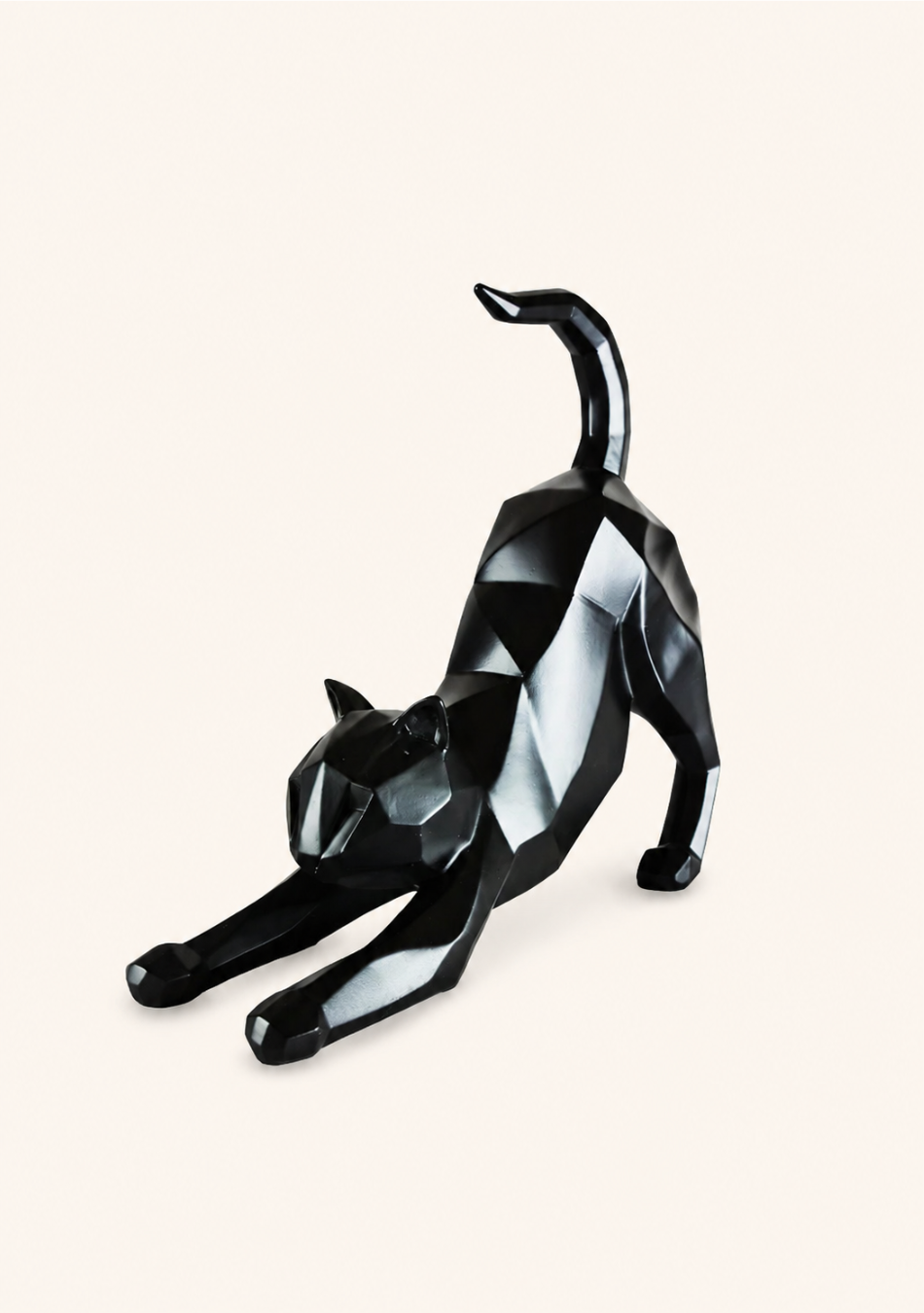 Aravalii Stretching Cheshire Cat whimsical resin sculpture variant in gold finish on a bedside table